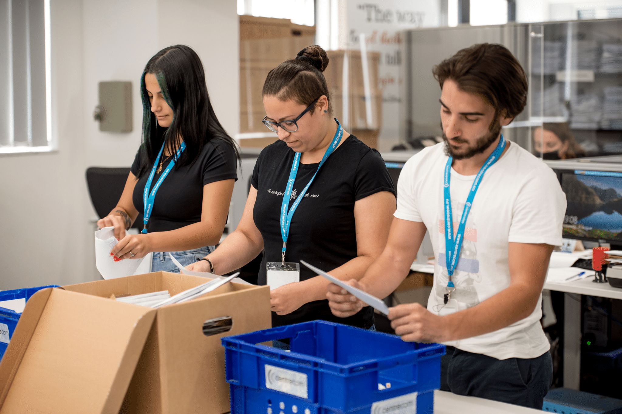 3 Colleagues sorting into boxes